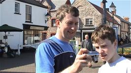 Michael and Joe at The Esplanade, Watchet, after coffee in the Corner Cafe which can be seen behind